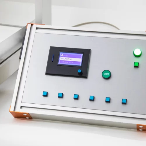 CNC machine control unit with LCD screen and operation buttons.